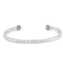 A delicate, open-ended charm bracelet in silver or gold with the text "Good Vibes Only" engraved on the band and a small crystal accent on each end.
