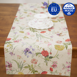 Floral table runner in cotton-linen mix, available in 140x40cm and 190x40cm sizes, featuring a colorful botanical print with flowers, leaves, and butterflies.