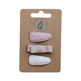  A set of 3 baby hair clips in pastel pink and ivory colors, featuring a bow and solid designs. Suitable for infants and toddlers.