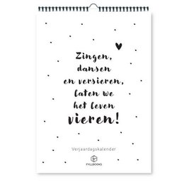 A black and white wall calendar with a motivational quote about singing, dancing, and celebrating life. The calendar has a minimalist design with a grid for writing down birthdays.