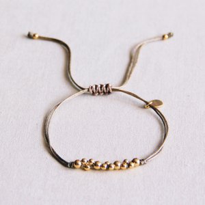 Satin bracelet with gold colored beads - taupe / gold