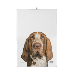 A 100% cotton kitchen towel featuring a close-up portrait of a brown and white Basset Hound dog.