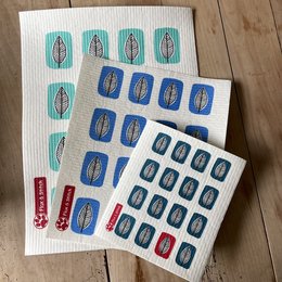 Compostable sponge cloths in standard, large, and XL sizes. Rectangular shape with blue and red patterns.