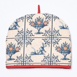 Delft blue tile design tea cosy with floral patterns and a red trim. Suitable for keeping tea warm.