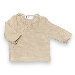 Beige wrap-style baby shirt with long sleeves. Made of soft, breathable cotton material. Suitable for infants and toddlers.