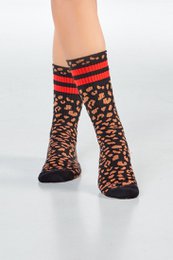  Black and red striped socks with leopard print pattern.