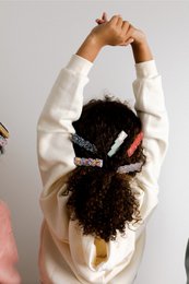 Colorful, textured hair clips in various shapes and styles, including turquoise and gold, gold glitter, pink and gold, lilac grey, purple and gold, polymer clay, caramel delight, crushed glass, mint and unicorn dust, blush and unicorn dust, blue and unicorn dust, unicorn dust, and pink and polymer clay.