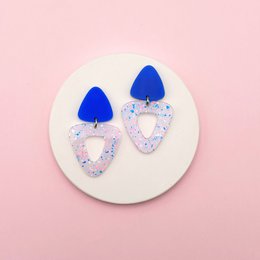  Blue neon terrazzo drop earrings with heart-shaped pendants and bell-shaped tops, geometric design.