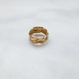 A gold-plated ring with a braided or woven design, suitable for casual or formal wear.