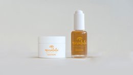 A set of day cream and face oil. The day cream is a white jar, and the face oil is in a clear glass bottle with a yellow liquid.