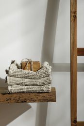 Waffled linen guest towel in a mini size, made of natural linen material, with a textured waffled pattern, suitable for a bathroom or guest room.