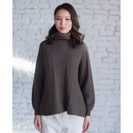  Cozy brown sweater with a high collar and long sleeves, perfect for layering during the colder months.