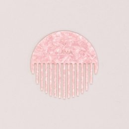  Pink hair clip with the word "MAMA" and a heart-shaped design, made of a soft, textured material.