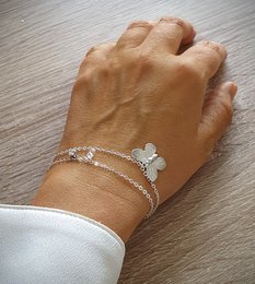 Silver double chain butterfly charm bracelet with delicate butterfly charm and adjustable chain.