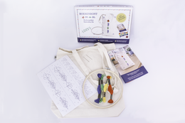 "Cream tote bag embroidery kit with colorful traditional Boerenbont pattern, includes thread and instructions"