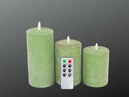 A set of three LED candles in a light green color, with a remote control. The candles appear to be cylindrical in shape.