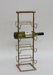 A gold-colored metal and wood wine rack with multiple shelves to hold wine bottles.