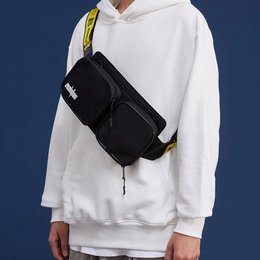 Black shoulder bag with adjustable strap and multiple compartments for storage.