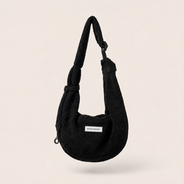  Black adjustable puppy carrier sling, soft fabric, shoulder bag style, small dog transport, cozy pouch design.