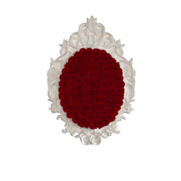 A large, ornate, oval-shaped frame with a vibrant red floral arrangement inside. The frame appears to be made of a light-colored material, possibly plaster or resin, with intricate, decorative details.