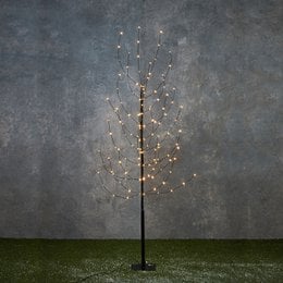 Tall black tree-shaped Christmas lighting fixture with warm white LED lights, suitable for indoor or outdoor use.