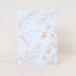 Postcard with floral design and text 'with love'. The postcard features a simple floral illustration in orange and white colors. The text 'with love' is printed in the center of the card.