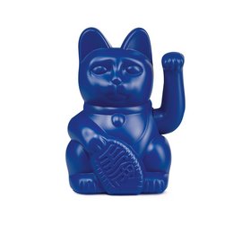Dark blue ceramic figurine of a lucky cat statue with raised paw.