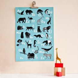 This poster features a collection of silhouetted animal illustrations in black against a light blue background. The animals depicted include various wild and domestic species such as bears, elephants, deer, cats, and more. The poster is designed for a kids' room or nursery.