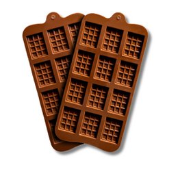 Orange silicone chocolate molds in the shape of mini chocolate bars. Ideal for homemade chocolate making and baking.