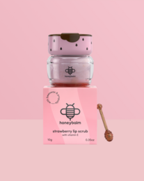  Pink strawberry lip scrub with wooden applicator, exfoliating face treatment, fruity scent cosmetic product.