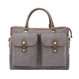 A large, rectangular weekend bag made of durable canvas material in a neutral beige-green color. The bag features two front pockets with brass-toned hardware, a top handle, and a detachable shoulder strap for versatile carrying options.