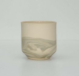 Grey ceramic mug with swirling pattern design.