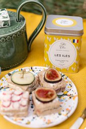 Organic tea with a floral, herbal aroma and flavor. Packaged in a tin with a label featuring a tropical island design.