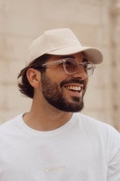 Beige cotton cap for men, featuring a classic baseball cap design with an adjustable strap for a comfortable fit.