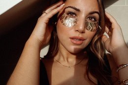 Gold eye pads for face masks, circular shape, metallic gold color.