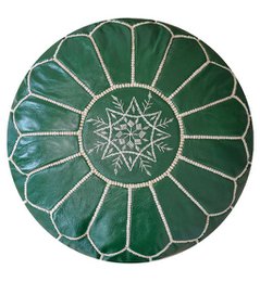  Olive green leather pouffe with intricate star-shaped pattern, suitable for use as a footstool or decorative accent piece.