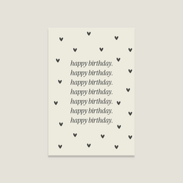  A white greeting card with the text "happy birthday" repeated multiple times, surrounded by small black heart shapes.
