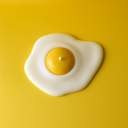  Egg-shaped pillar candle with a simple dish, available in various colors.
