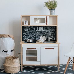 Chalkboard-style foil and back panel for IKEA children's play kitchen, featuring a playful, hand-drawn design with kitchen-related elements.