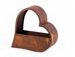 Rustic heart-shaped planter made of weathered metal, suitable for indoor or outdoor use, can hold small plants or decorative items.
