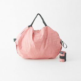 Shupatto borsa shopping pieghevole compatta taglia S - Pesca (Momo)