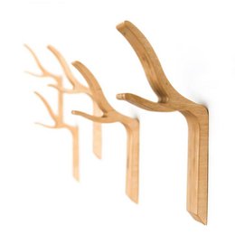  A natural wood wall hook with a simple, minimalist design. Made of high-quality wood, this hook is perfect for hanging coats, bags, or other items in your home or office.