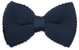 A dark blue knitted bow tie with a textured honeycomb pattern. The bow tie has a classic shape and is made from a high-quality knitted material, providing a stylish and sophisticated accessory for formal or casual wear.