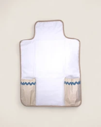 Blue gray changing mat with woven pockets, soft padded surface, neutral colors, baby care essential.