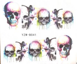Colorful skull-themed water transfer tattoos featuring abstract designs and splatter effects. Suitable for manicure sets or other personal accessories.