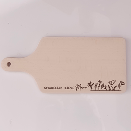 Rectangular wooden cutting board with engraved text and design. Made of light-colored wood material. Suitable for food preparation and serving.