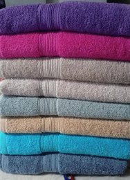  Soft cotton bath towels in multiple colors: beige, grey, fuchsia, blue, turquoise, purple. Available in three sizes.