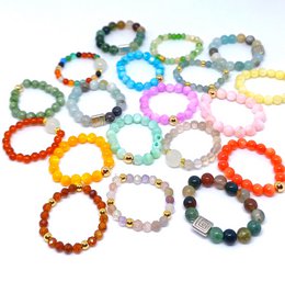  Colorful stretch rings in a variety of shapes, materials, and styles. Includes rings with beads, stones, and other decorative elements. Suitable for casual or statement jewelry.