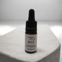 Essential oil No.17 with citrus, lavender, and tonka scents. Packaged in a dark glass bottle with a dropper.