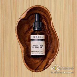  3000mg CBD oil drops in a wooden bowl, made from natural ingredients.